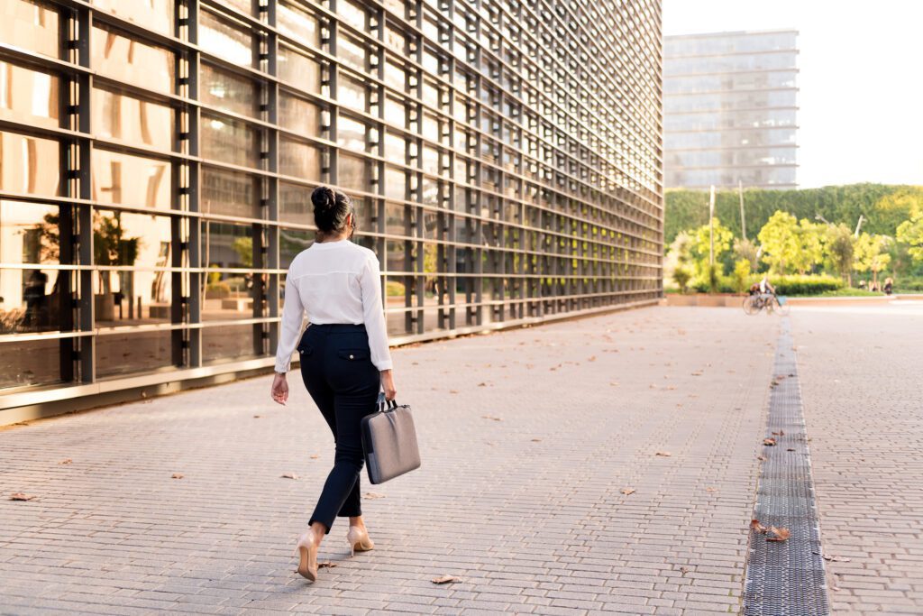 Woman taking a walk during a work break as part of healthy lifestyle tips for office professionals."