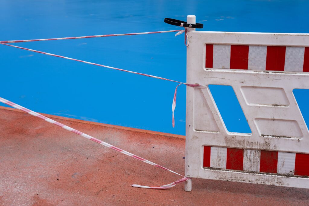 red and white Barriers - to represent the barrier that disabled and neuro divergent people may face. Reasonable adjustments are ways to breakdown those barriers.